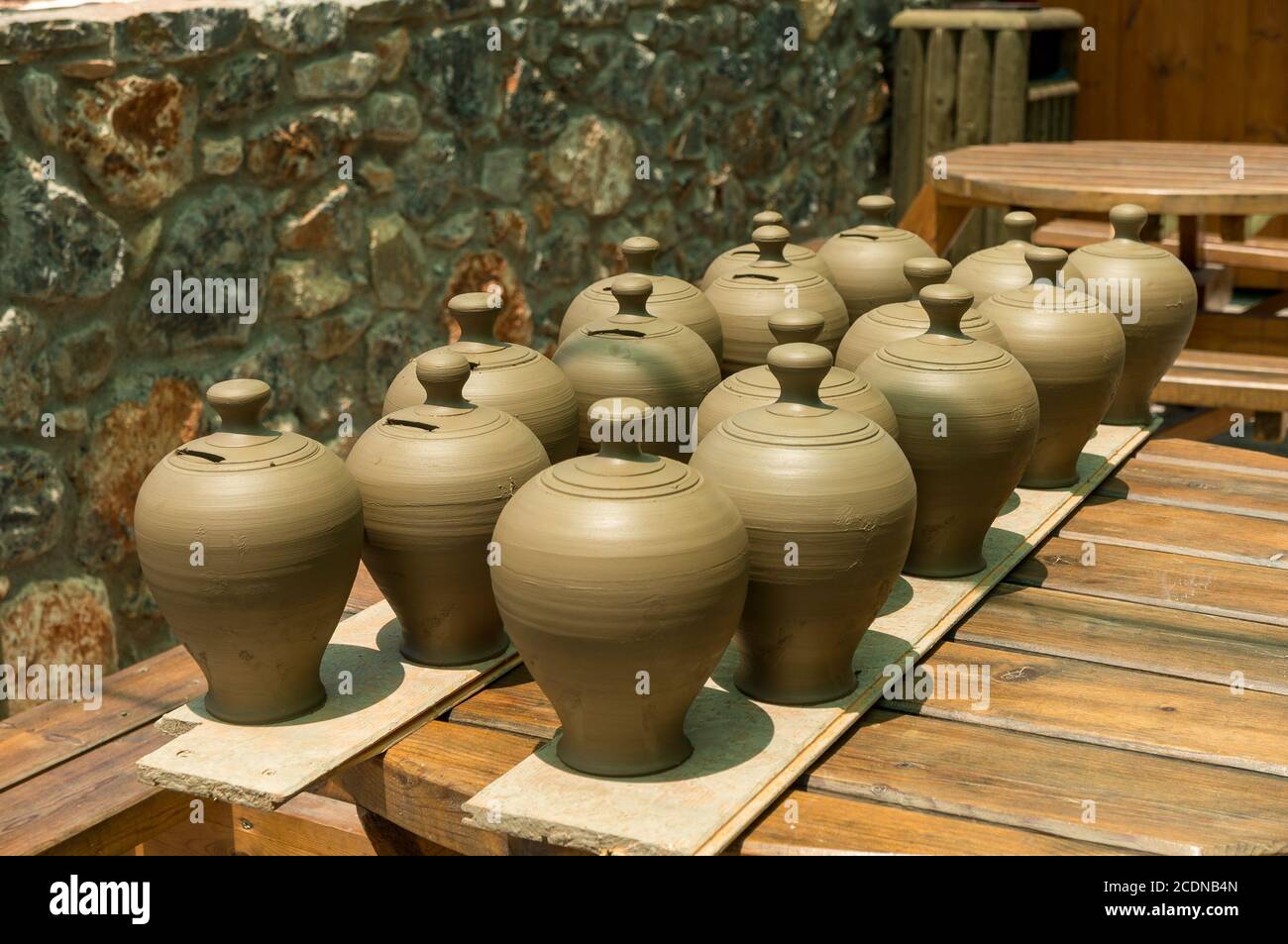 Many pots kept for drying in the sun Stock Photo