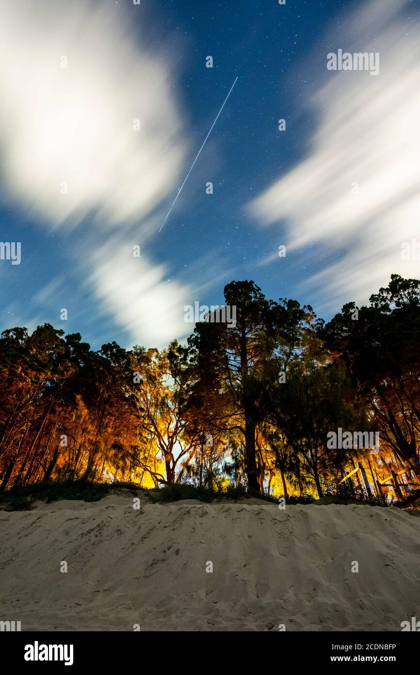 Trail of International Space Station in night sky as it passes over Hervey bay Queensland Australia Stock Photo