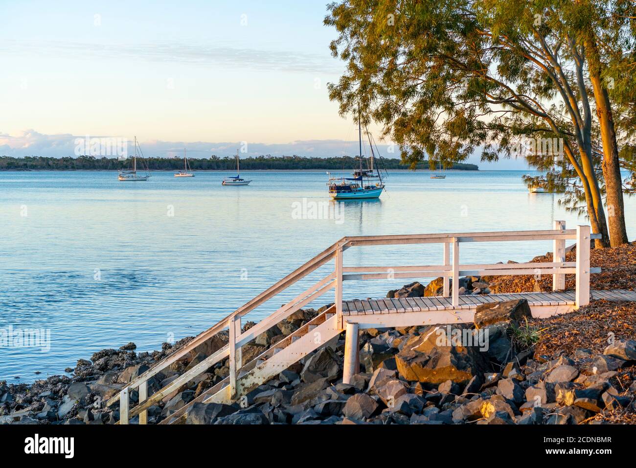 Boats anchored in Burrum river at sunset, Burrum Heads, Queensland