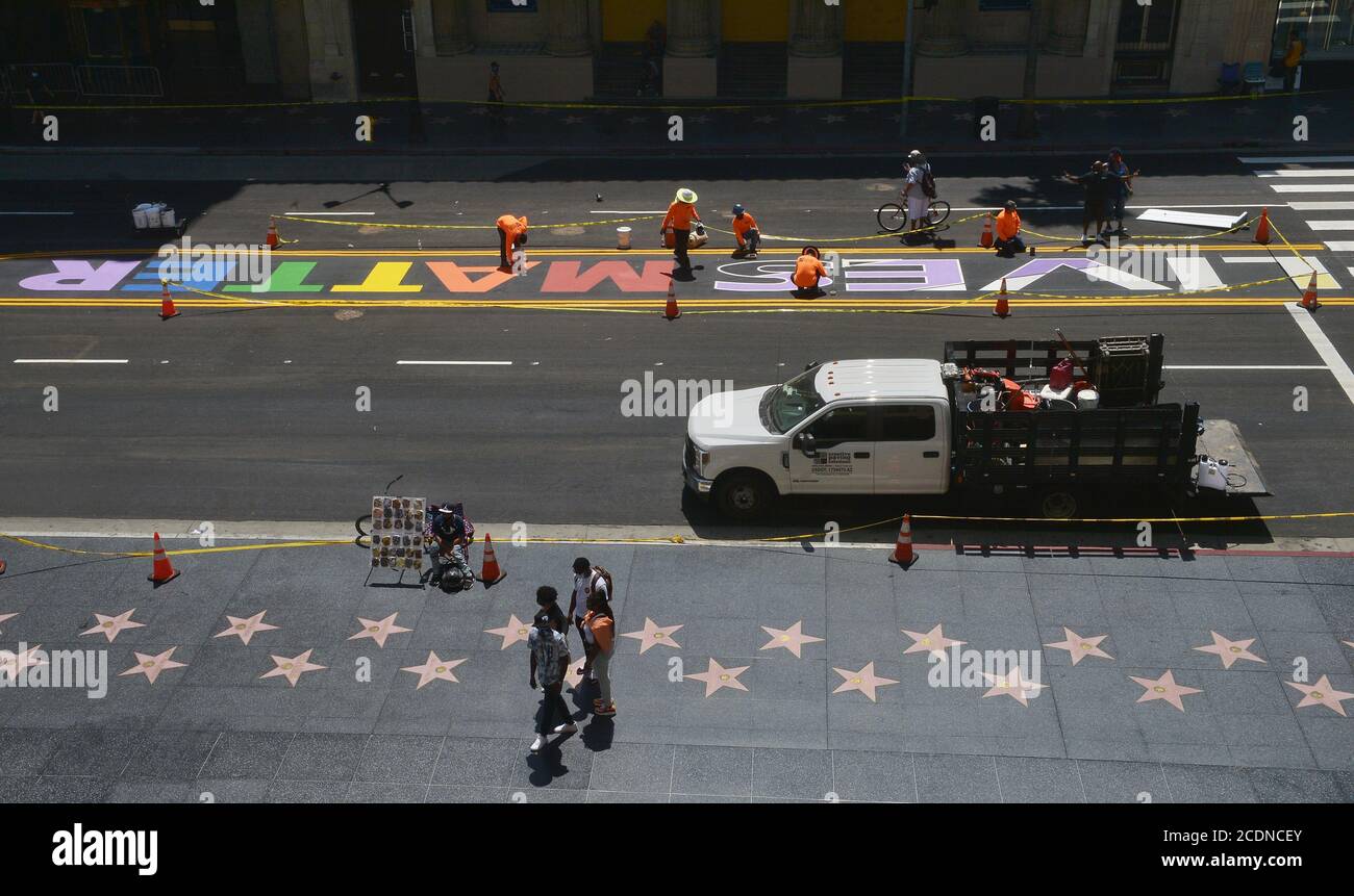 Los Angeles, United States. 29th Aug, 2020. Los Angeles Bureau of Street Services crew members put the finishing touches on the 'All Black Lives Matter' mural on Hollywood Blvd. on Friday, August 28, 2020. The mural will serve as a tribute following a massive protest against racism and in solidarity with the black LGBTQ community in the wake of the killing of George Floyd in Minneapolis. The permanent installation is bordered by the Dolby, TCL Chinese, and El Capitan theatre's. Photo by Jim Ruymen/UPI Credit: UPI/Alamy Live News Stock Photo