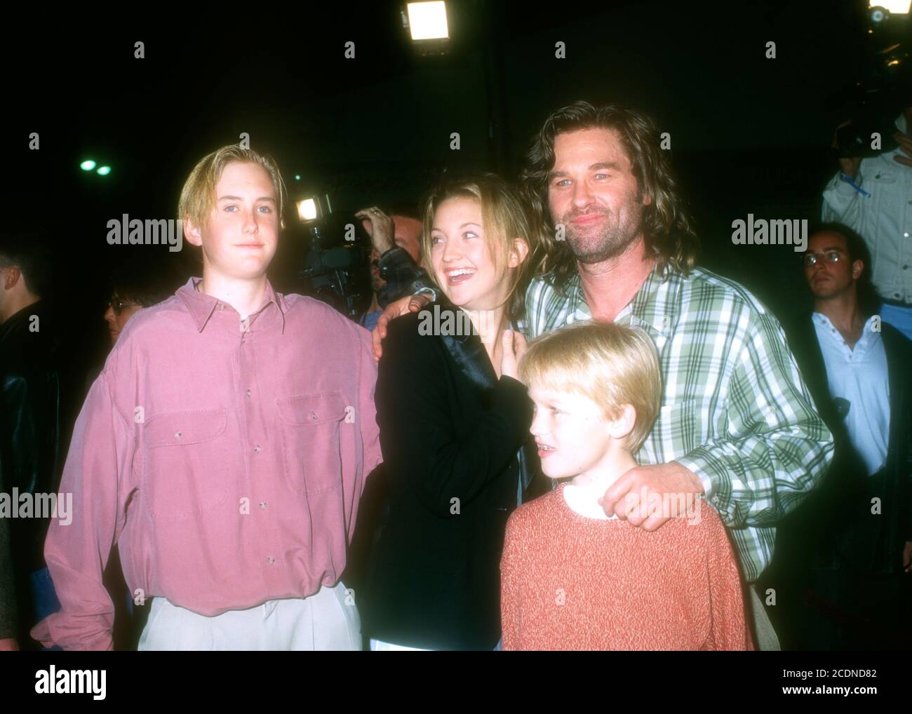 Westwood, California, USA 11th March (L-R) Boston Russell, Actress Kate Hudson, actor Kurt Russell and son Russell attend Warner Bros. Pictures' 'Executive Decision' Premiere on March 11, 1996 Mann