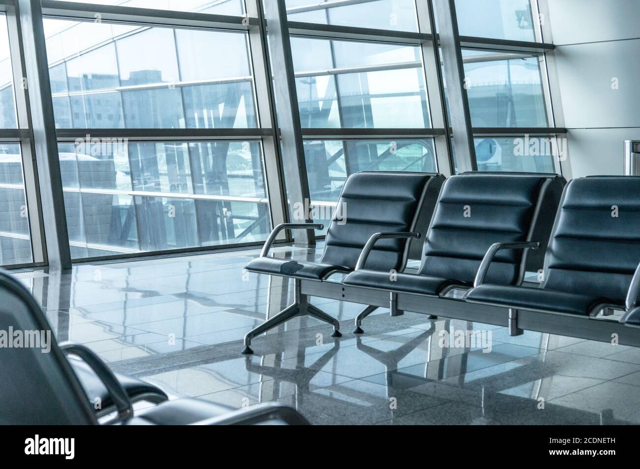 airport waiting area , seats and outside the window scene Stock Photo