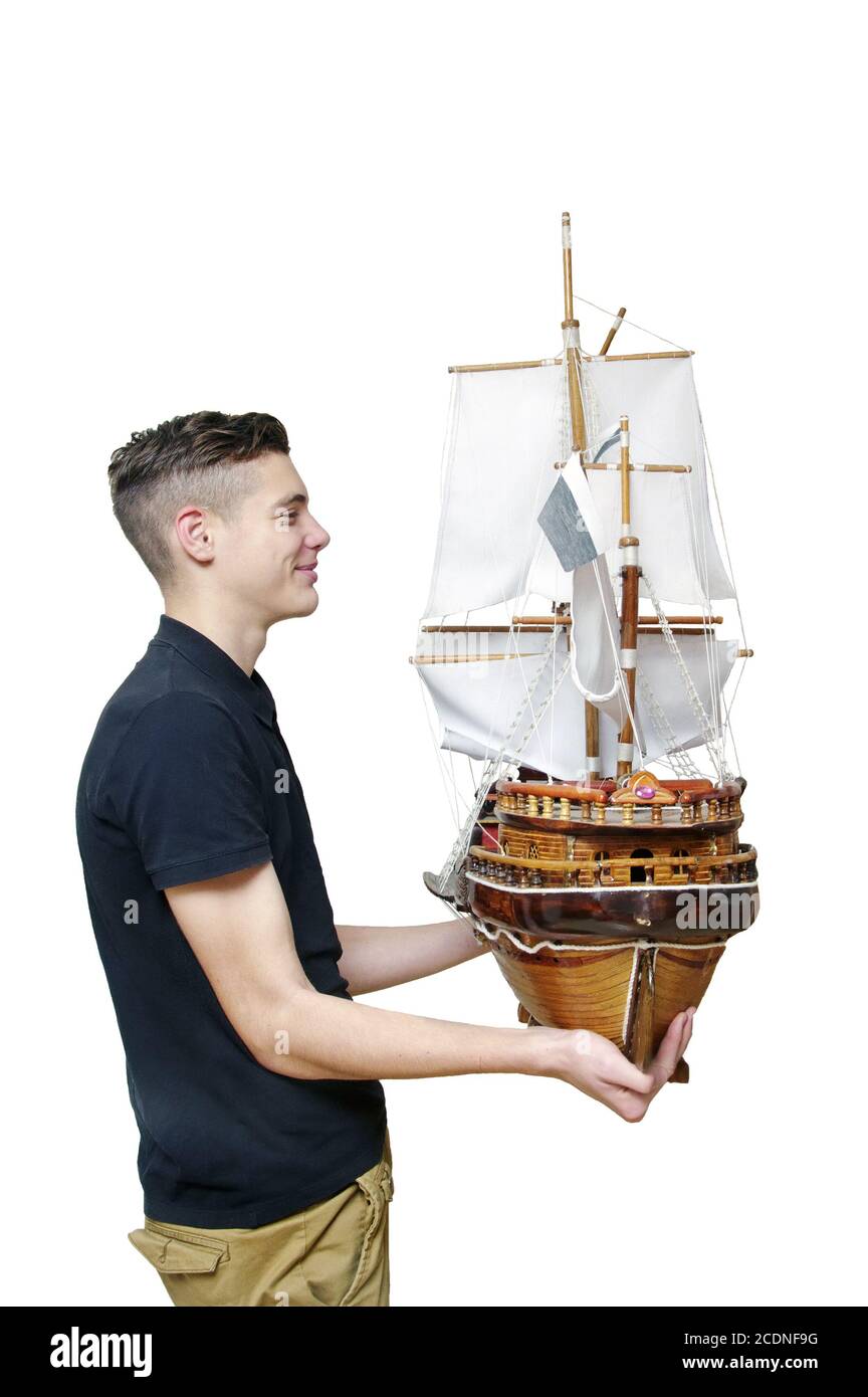 Boy  looks at the model  tallship Stock Photo