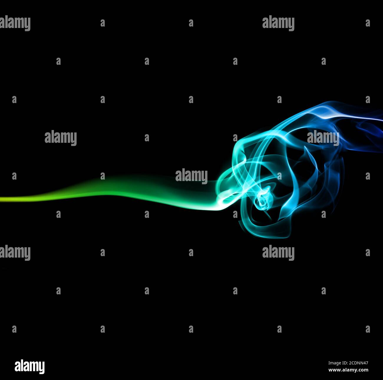 Green and blue smoke on dark Stock Photo - Alamy