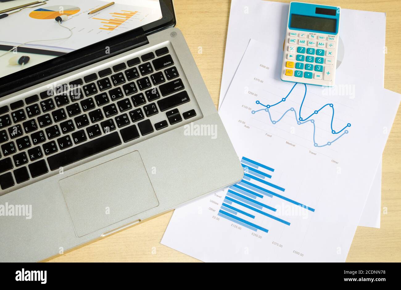 laptop and graph Stock Photo - Alamy