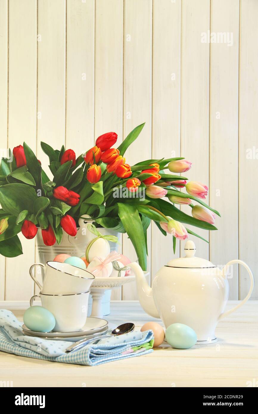 Tulips and colored Easter eggs Stock Photo