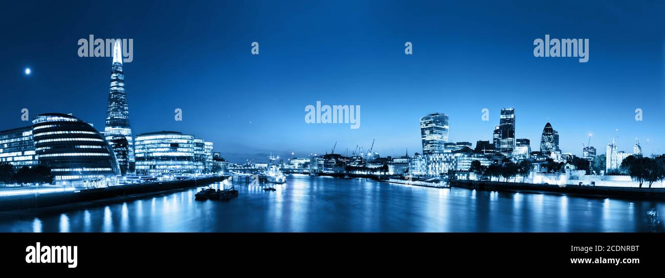 London skyline panorama at night, England the UK. River Thames, the Shard, City Hall. Stock Photo