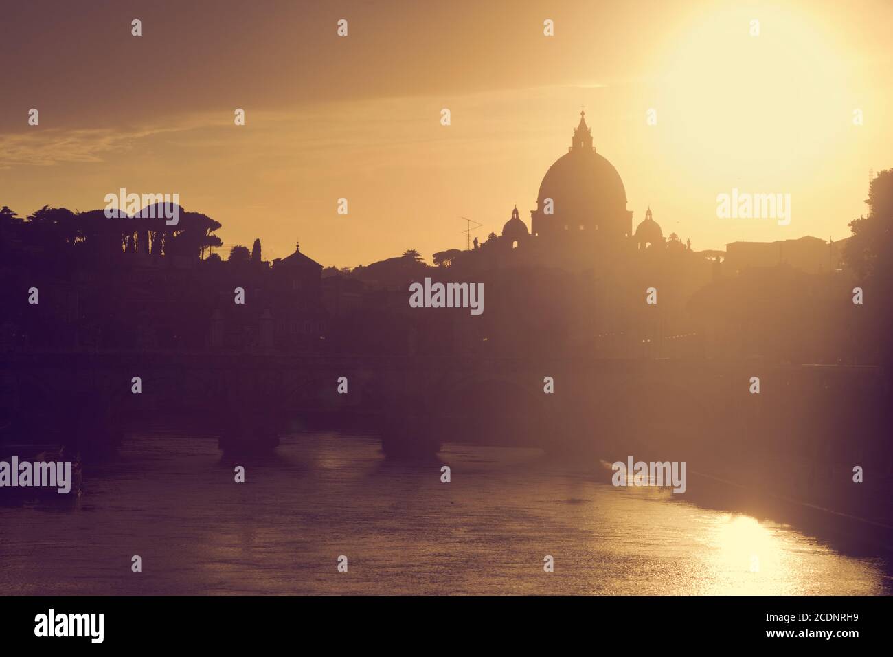 St. Peter#39;s Basilica, Vatican City.  Tiber river in Rome, Italy at sunset Stock Photo