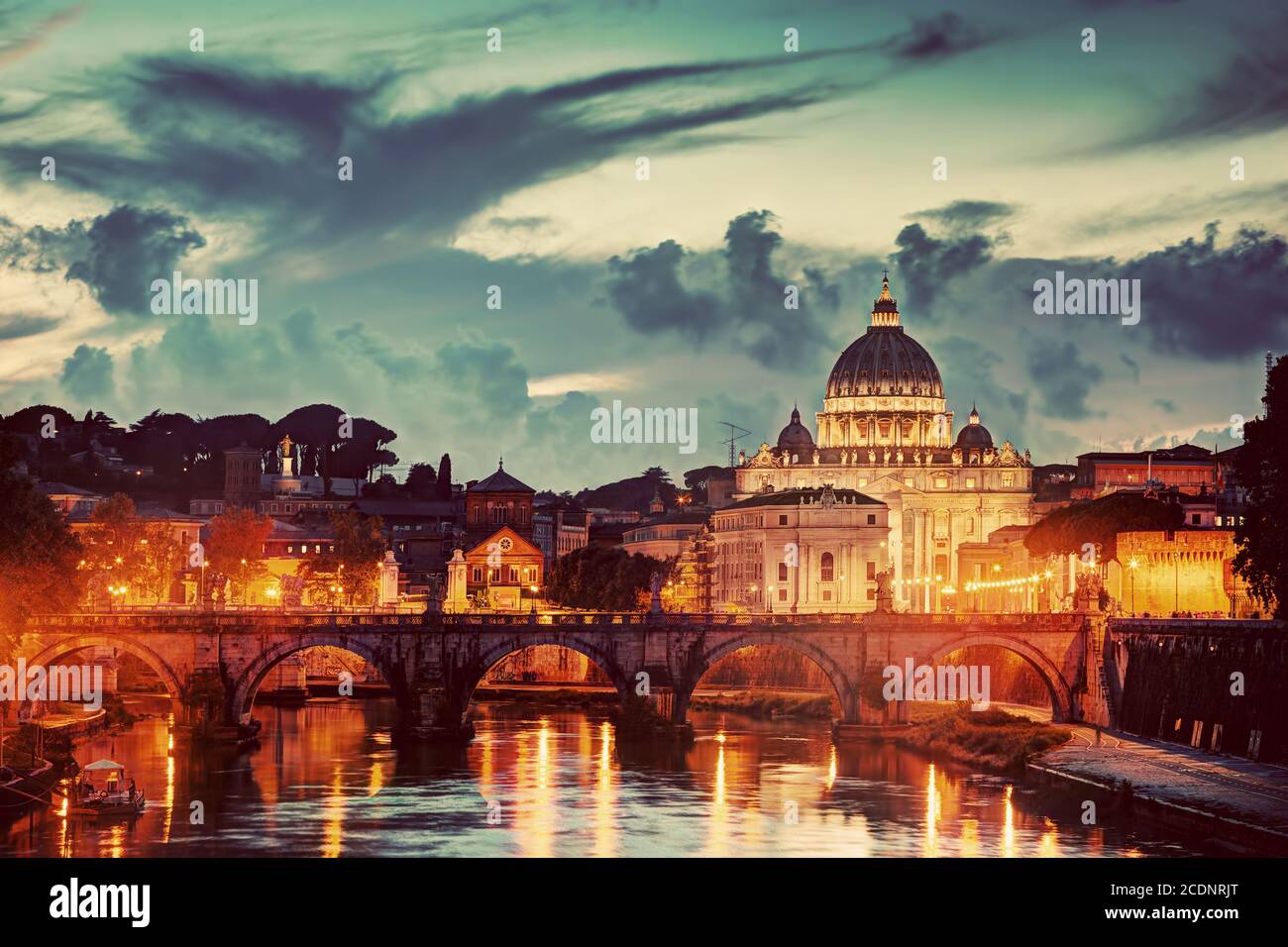 St. Peter#39;s Basilica, Vatican City.  Tiber river in Rome, Italy at late sunset, evening. Stock Photo