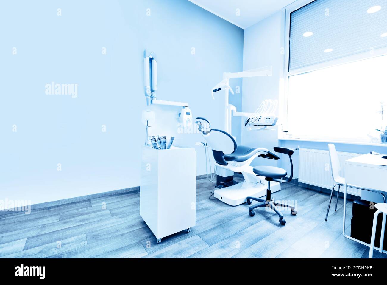 Dentist#39;s office. Dental equipment, modern, clean interior. Blue tone Stock Photo