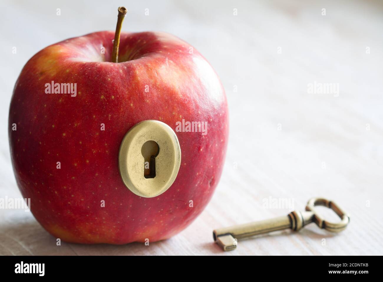 Key and apple, key to health. Healthy eating concept Stock Photo