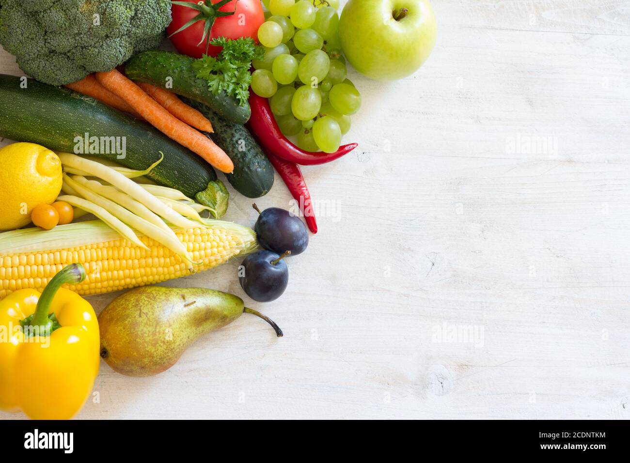 Fresh fruits and vegetables on white background. Free space for text Stock Photo