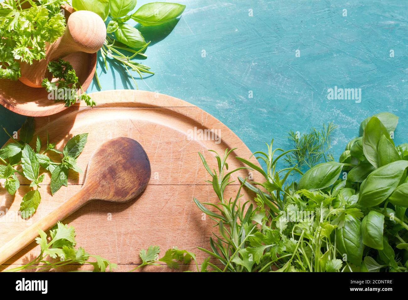 Kitchen table background with fresh herbs and empty space Stock Photo