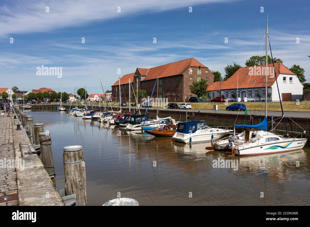 Inner harbor of the town of Tonning in North Friesland with the large packing house from 1783 Stock Photo