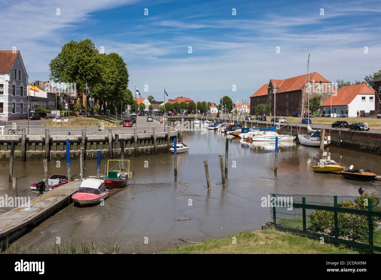 Inner harbor of the town of Tonning in North Friesland with the large packing house from 1783 Stock Photo