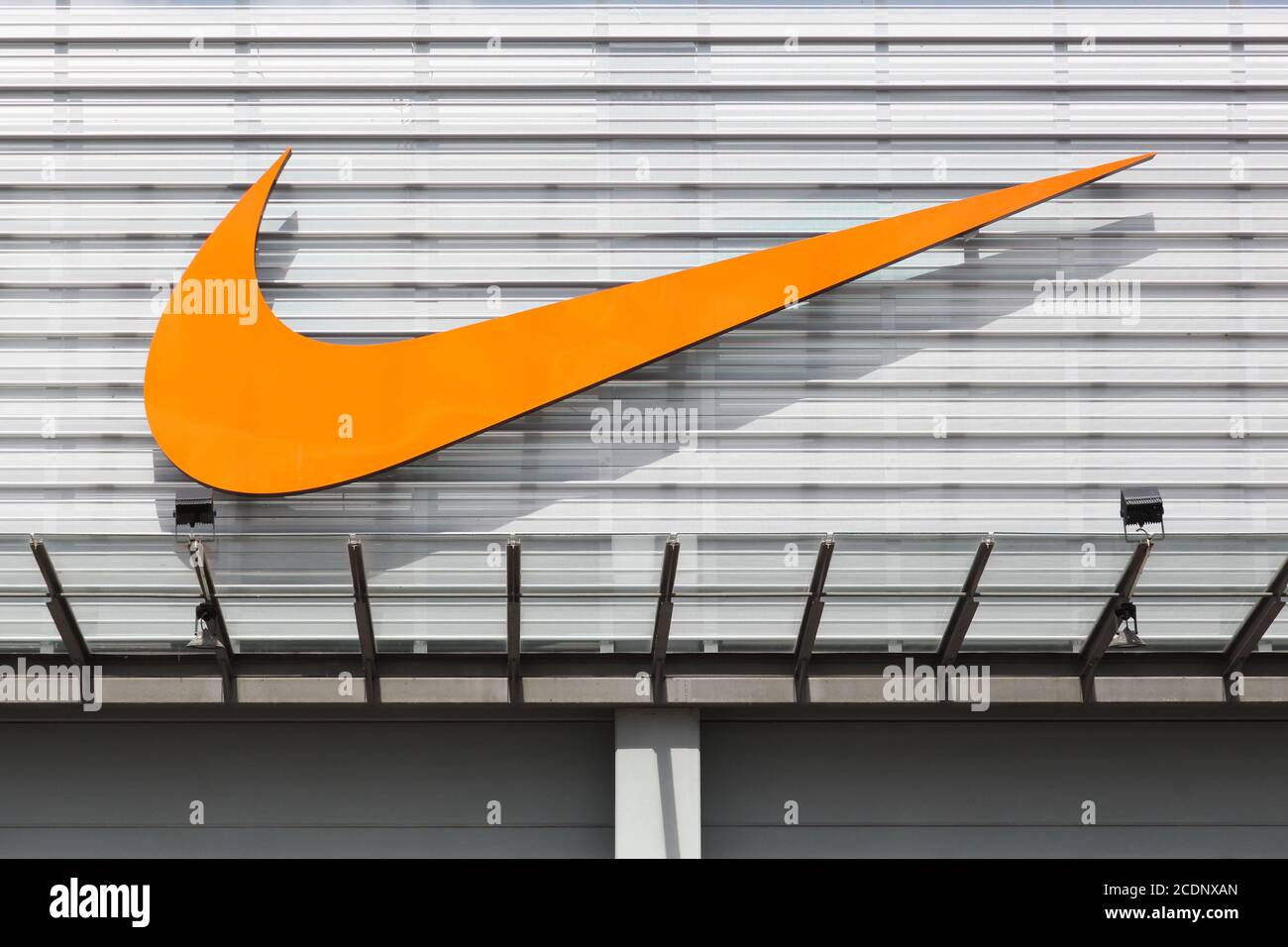 Bremen, Germany - July 2, 2017: Nike logo on a facade of a store. Nike is an American company specializing in sports equipment based in Beaverton Stock Photo