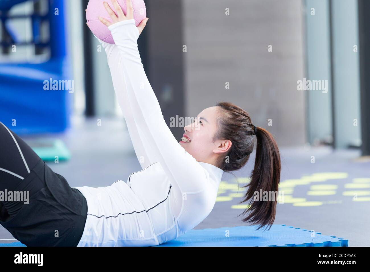 young asian girl doing yoga in modern gym Stock Photo - Alamy