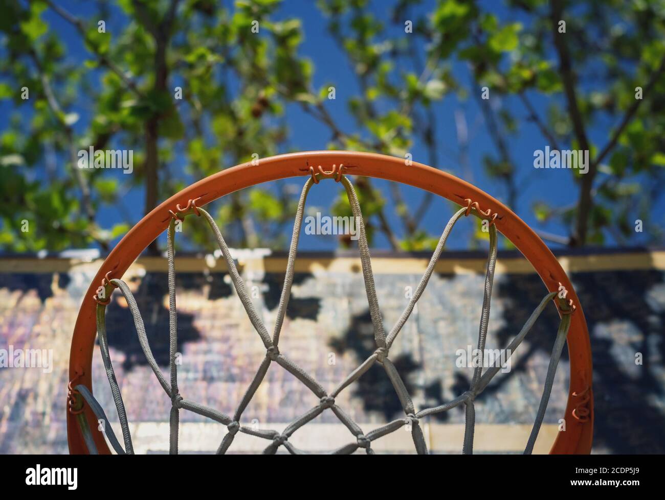 Detail of a basketball hoop on the playground viewed from below Stock Photo
