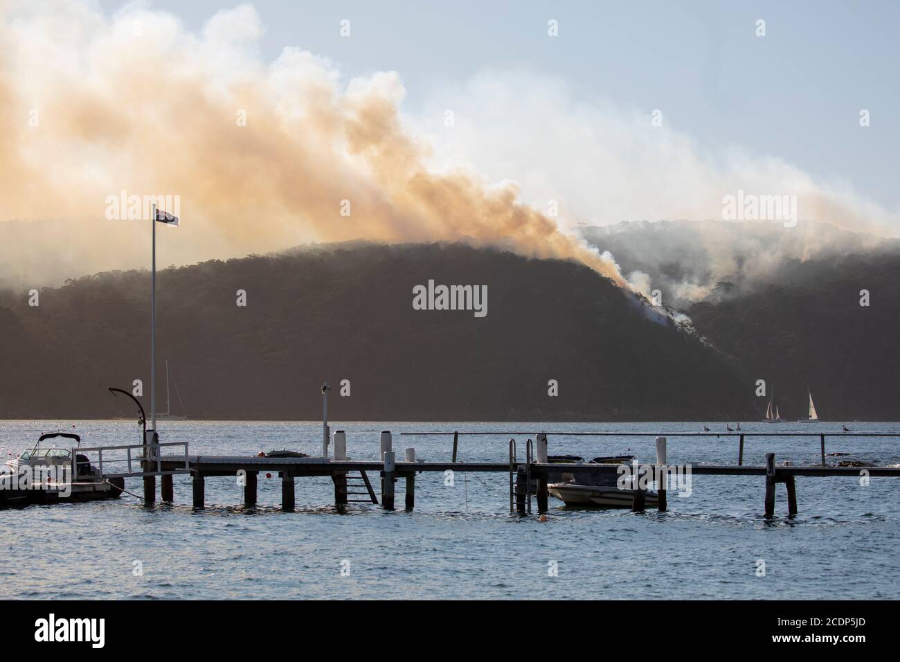 Australia bushfire season and rural fire brigade conduct controlled hazard reduction burning in