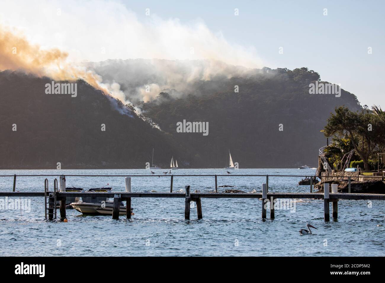 Australia bushfire season and rural fire brigade conduct controlled hazard reduction burning in