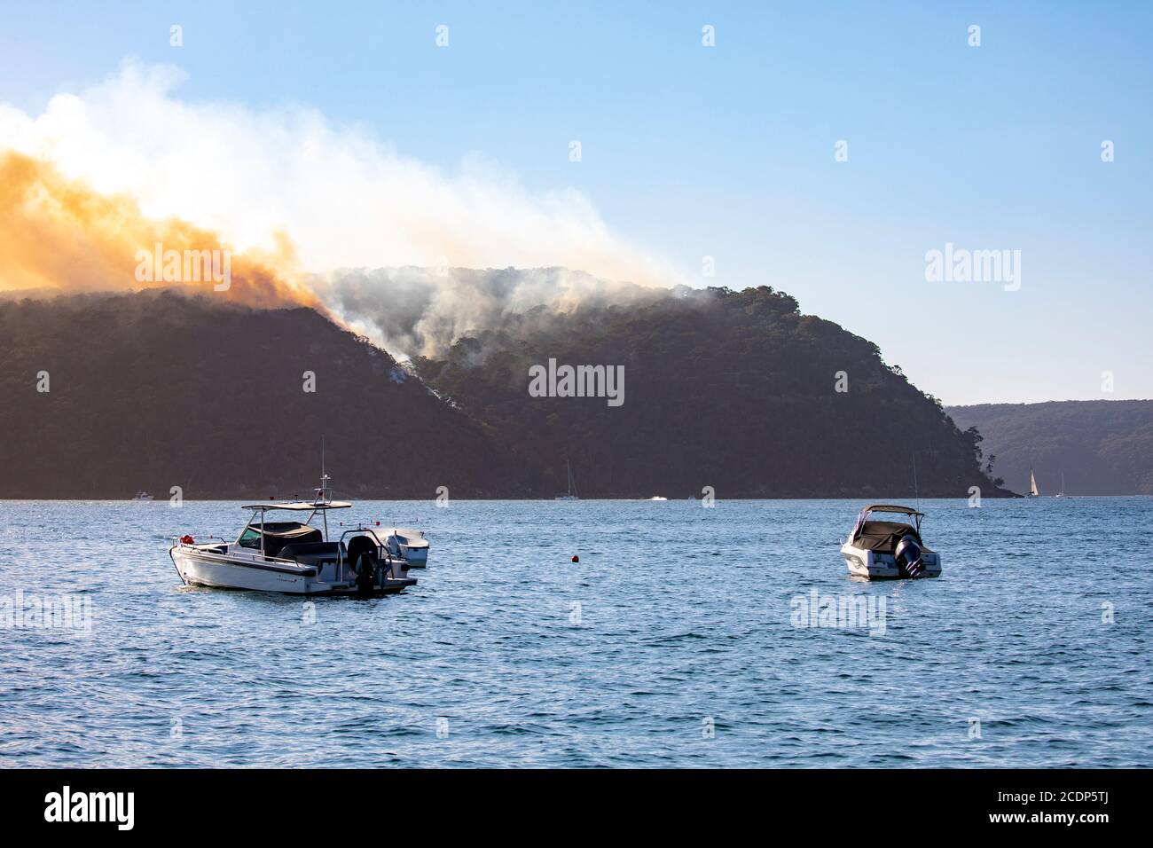 Australia bushfire season and rural fire brigade conduct controlled hazard reduction burning in