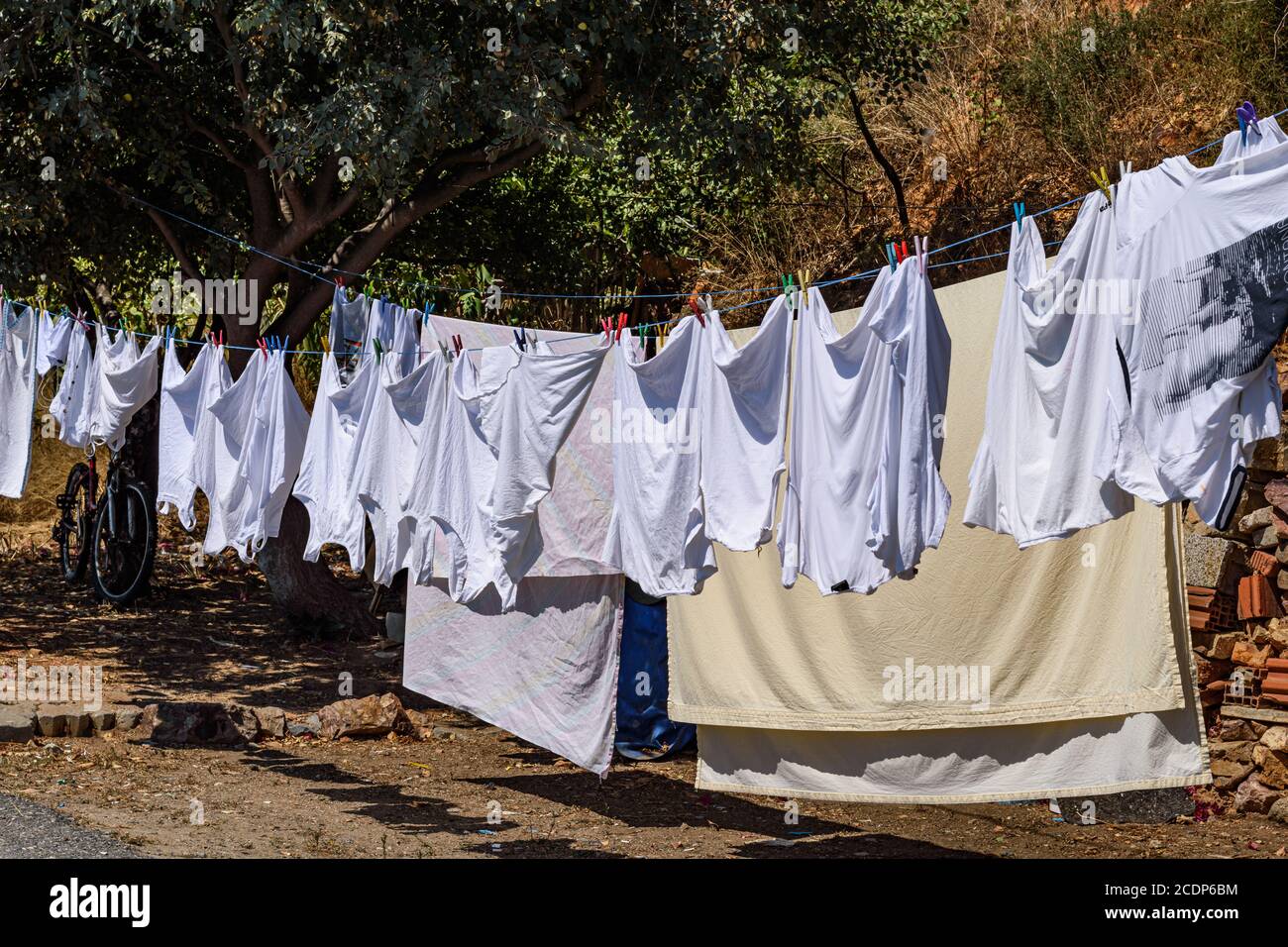 Outdoor clothes drying solution on a sunny day on Craiyon