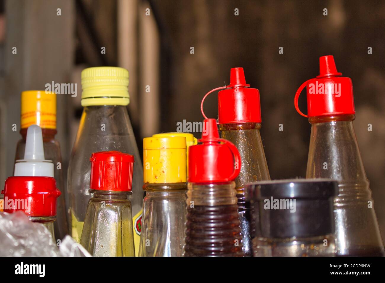 Plastic sauce bottles with colorful caps Stock Photo Alamy