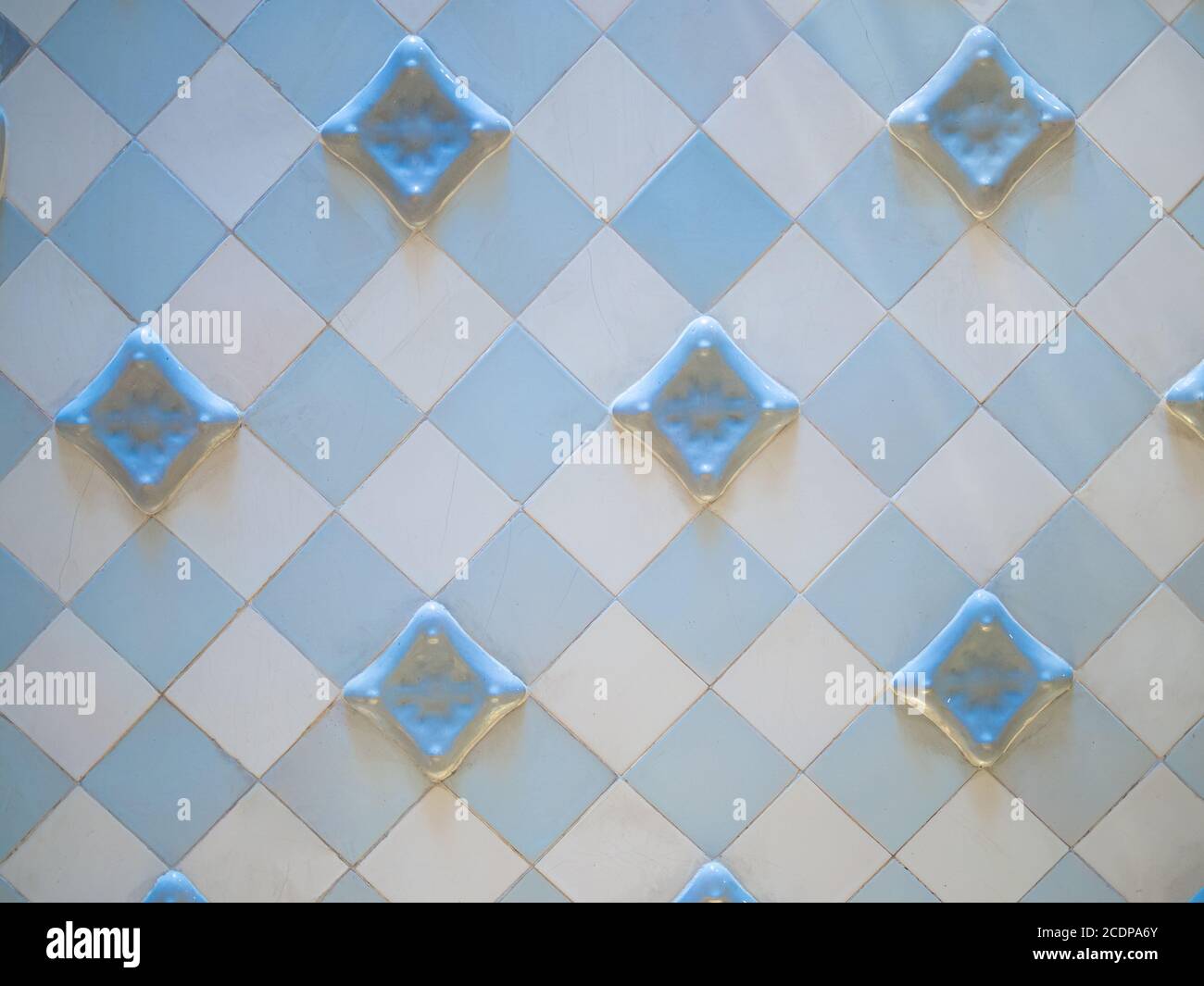 Real antique wall tiles background texture. White and blue checkered