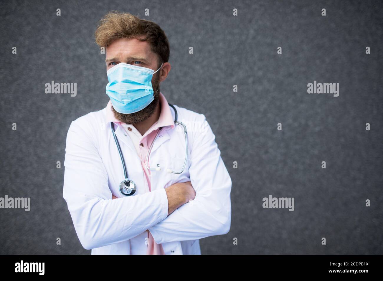 Doctor in white medical uniform hi-res stock photography and images - Alamy