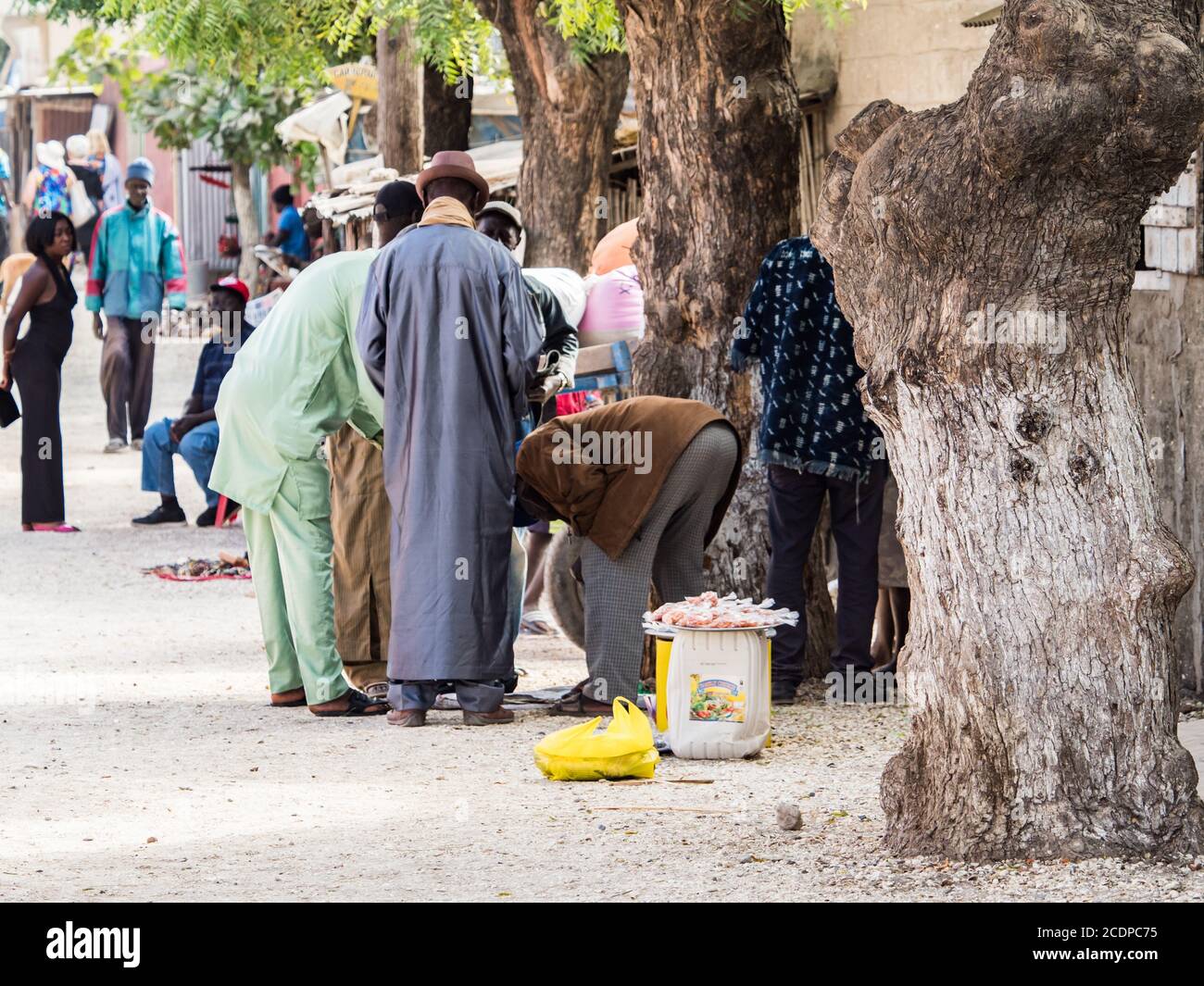 Joal-Fadiout, Senegal - January, 26, 2019: Street seller on  the seashell island.  Joal-Fadiouth town and commune in the Thiès Region at the end of th Stock Photo