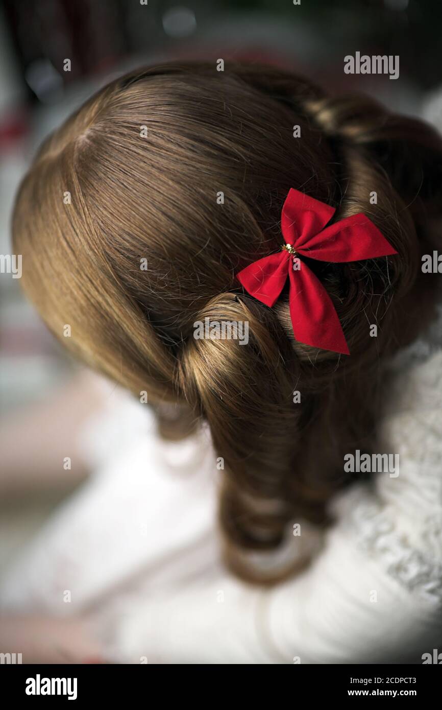 Victorian, historic seeming Christmas scene with young redheaded woman in a antique dress Stock Photo