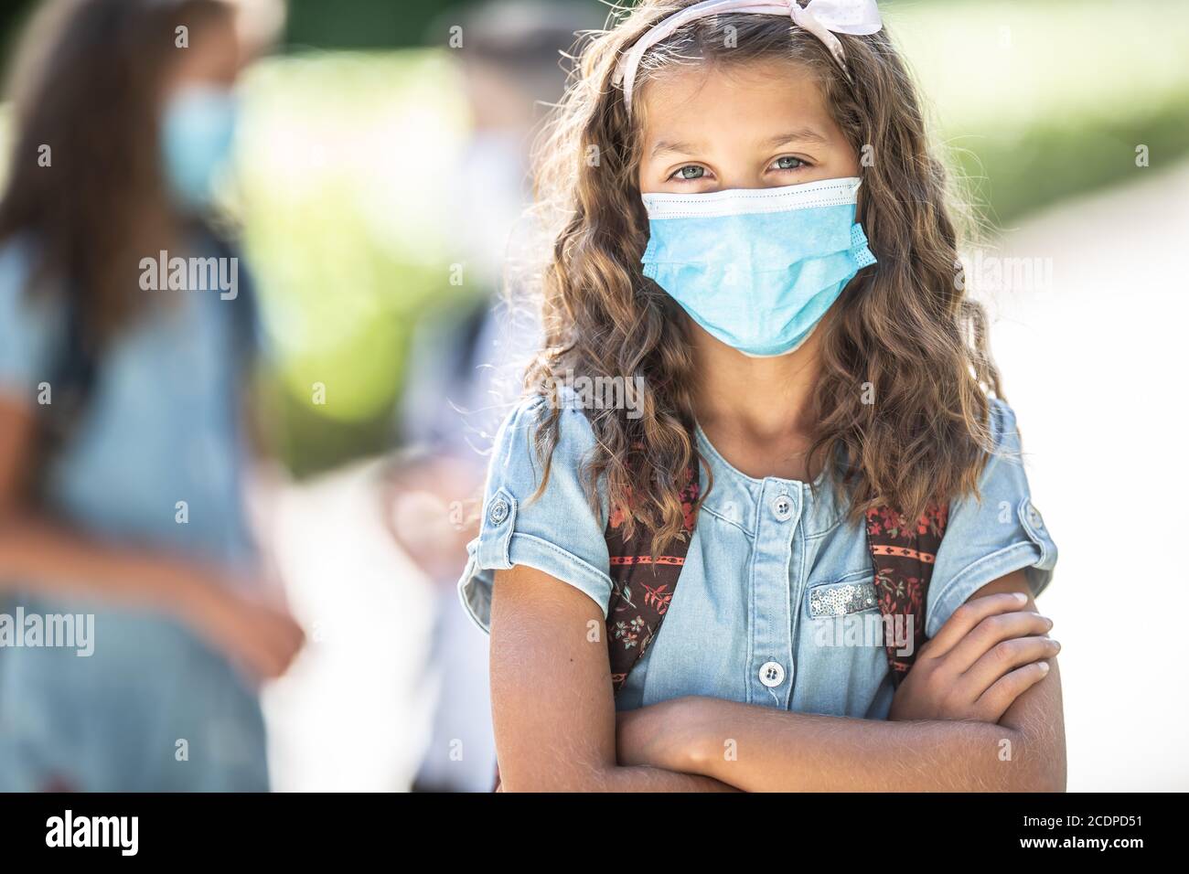 Portrait of a school girl with face mask during Covid-19 quarantine. Stock Photo