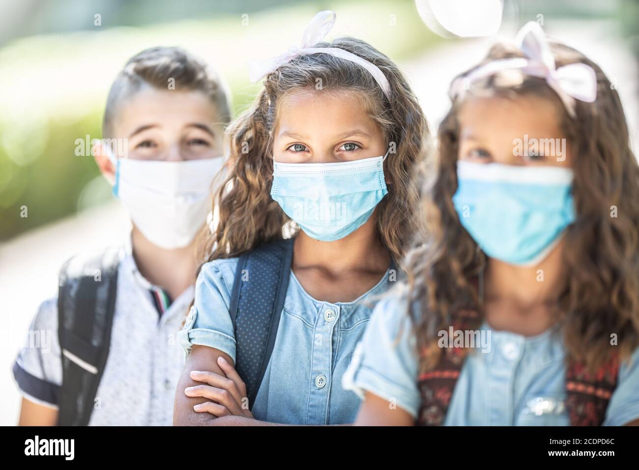 Portrait of schoolchildren with face masks during Covid-19 quarantine. Stock Photo