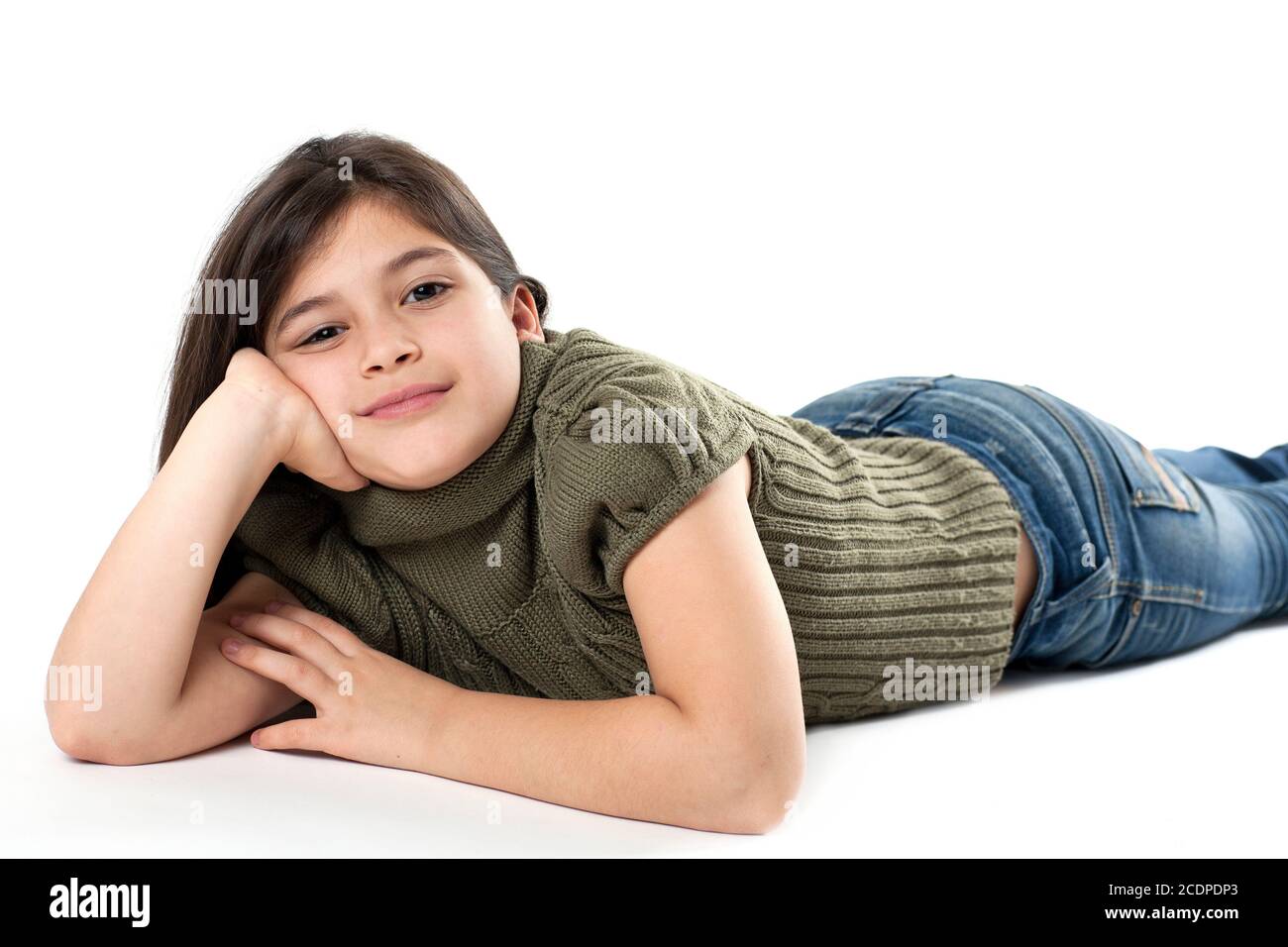 On the floor lying young girl front in of white background Stock Photo