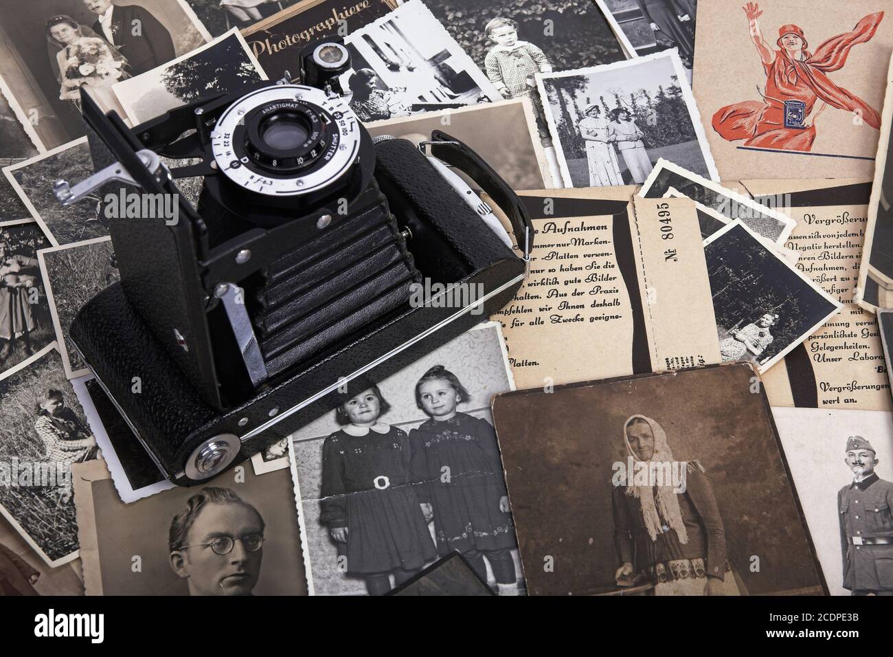 Nostalgic photographs with historical film bags and roll film camera, genealogy Stock Photo