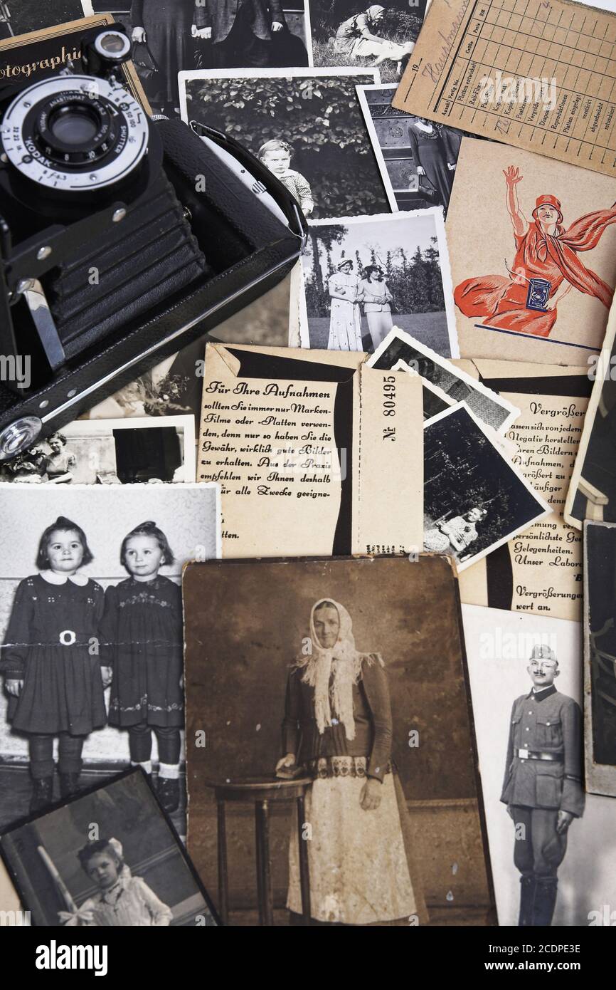 Nostalgic photographs with historical film bags and roll film camera, genealogy Stock Photo