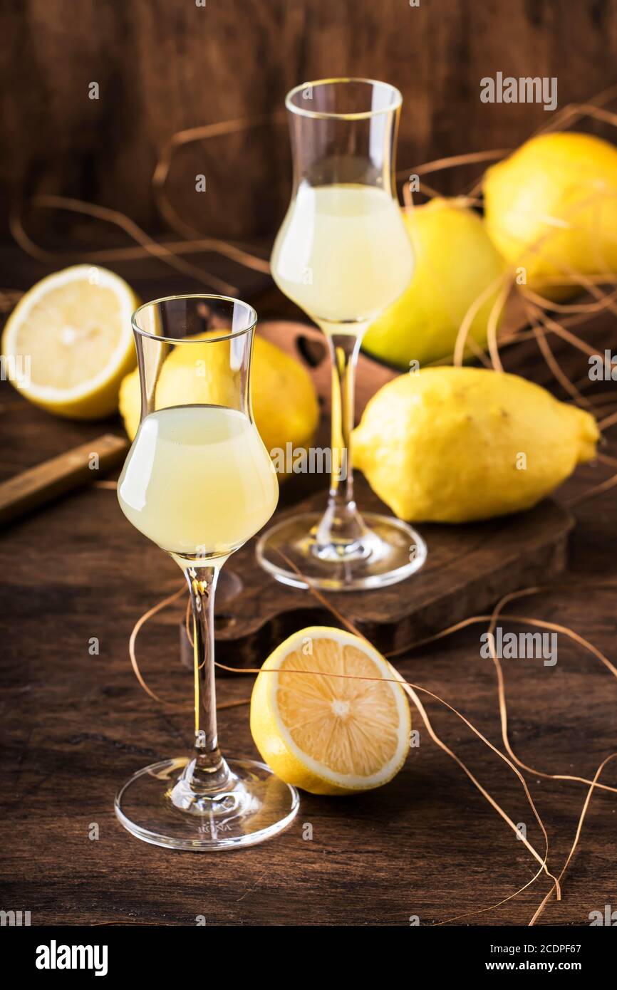 Limoncello, sour sweet Italian lemon liqueur, traditional strong alcoholic drink. Copy space, selective focus Stock Photo