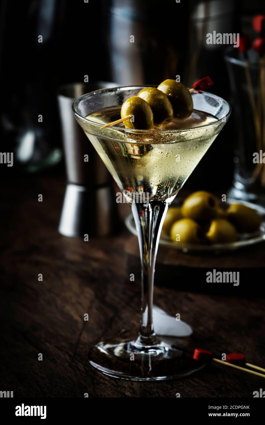 Martini cocktail, with dry vermouth, vodka and green olives, vintage