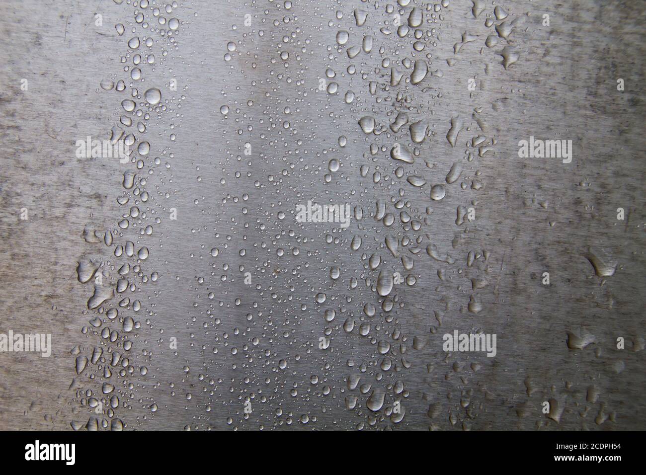 Raindrops on steel wall detail Stock Photo