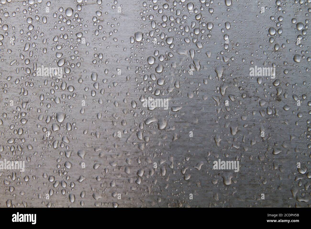 Raindrops on steel wall detail Stock Photo