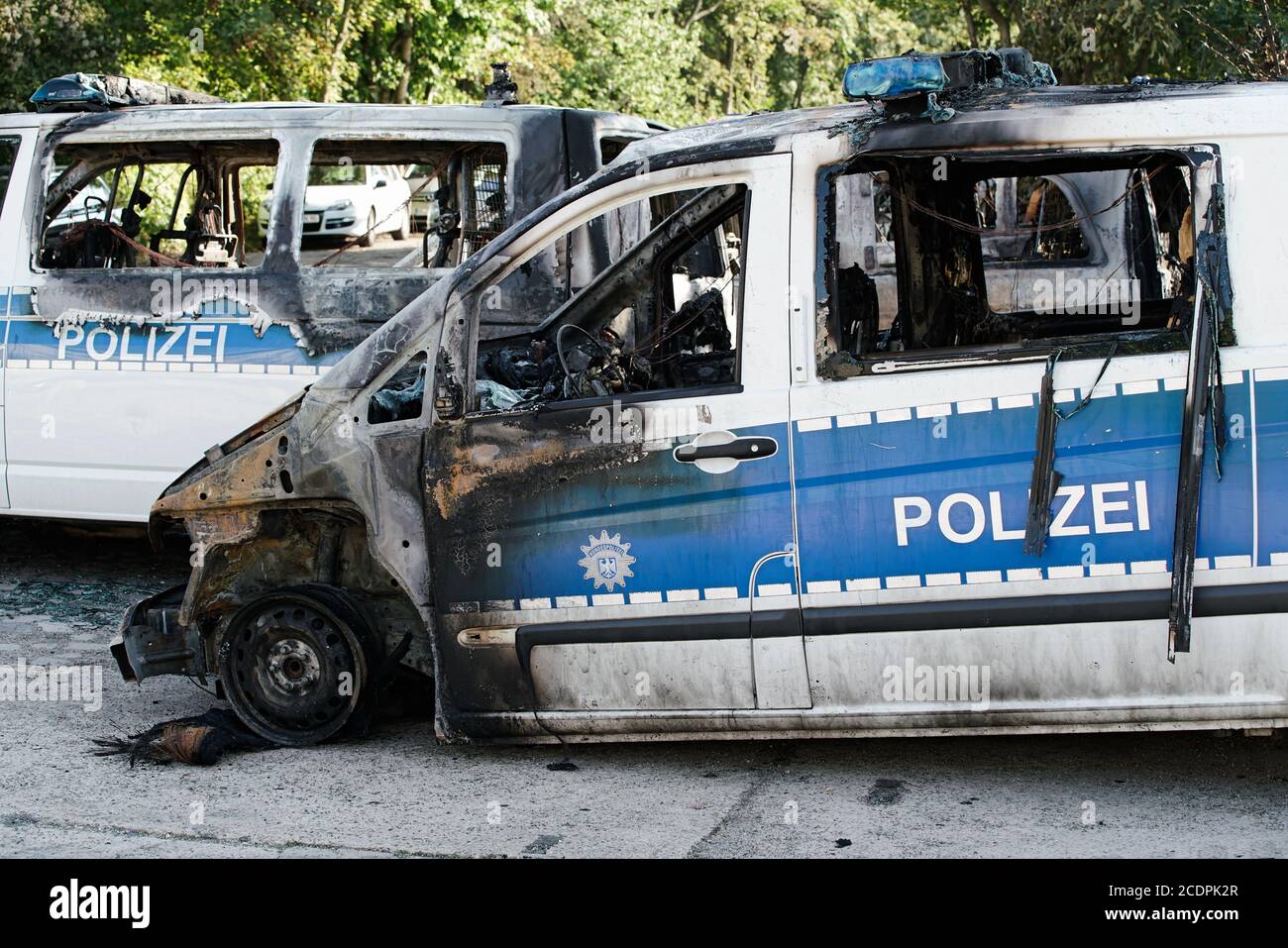 Burnt-out cars after an arson attack on police cars in the center of Magdeburg Stock Photo