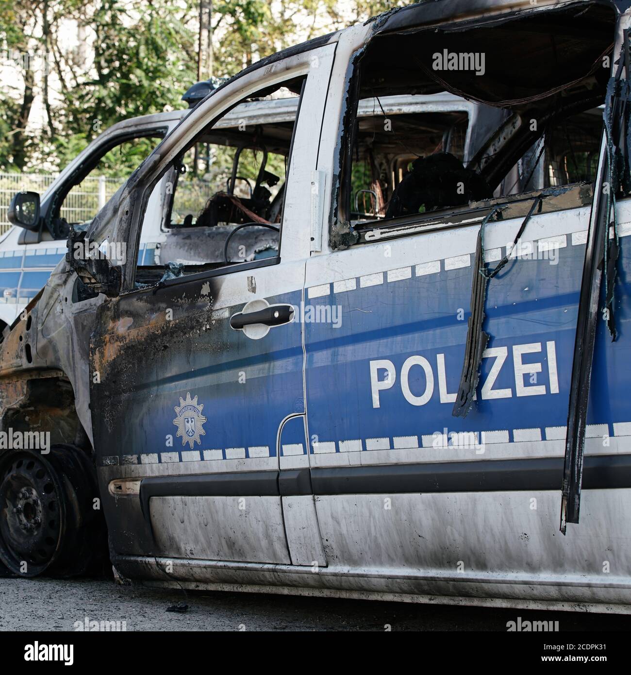 Burnt-out cars after an arson attack on police cars in the center of Magdeburg. Stock Photo