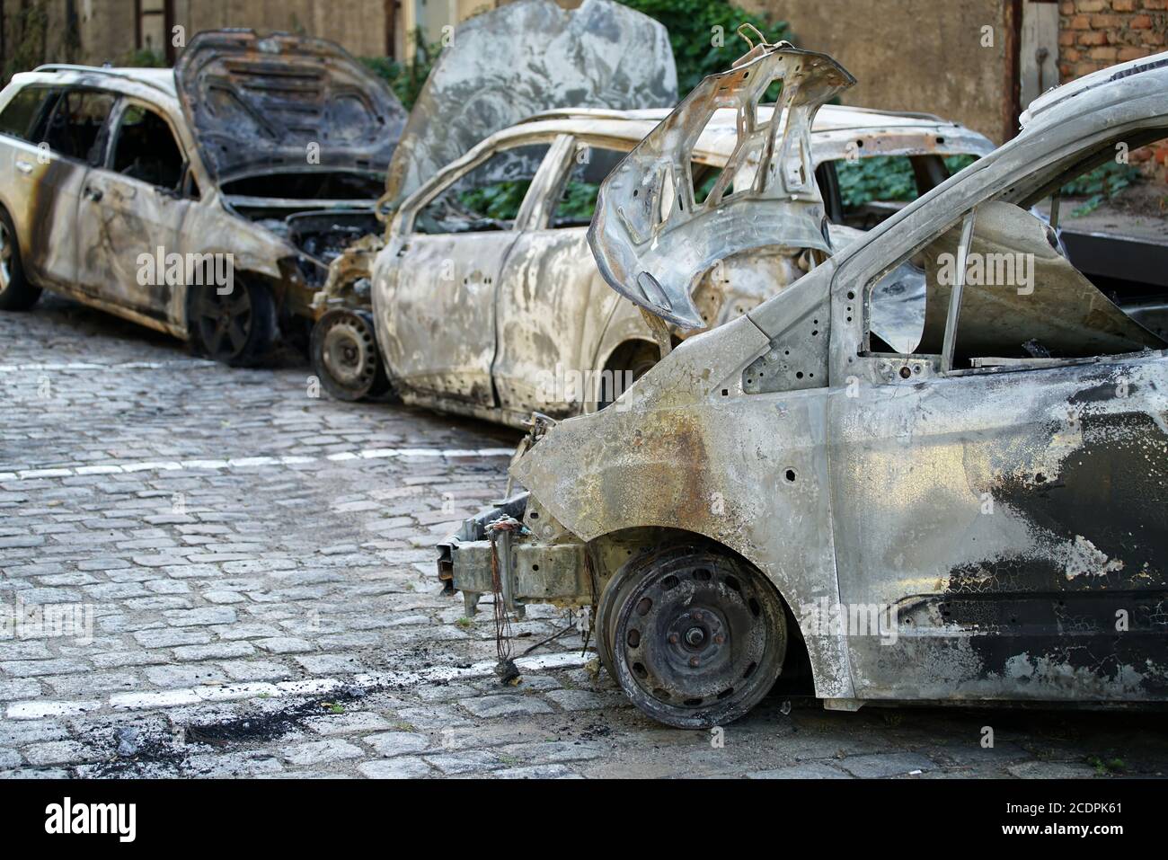Burnt-out cars after an arson attack in the center of Magdeburg Stock Photo