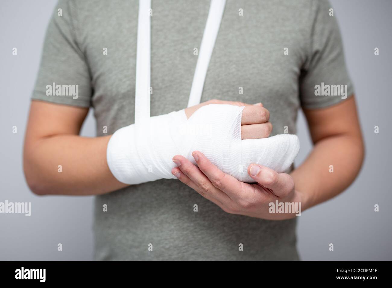 fracture and first aid concept close up of male hand with bandage and