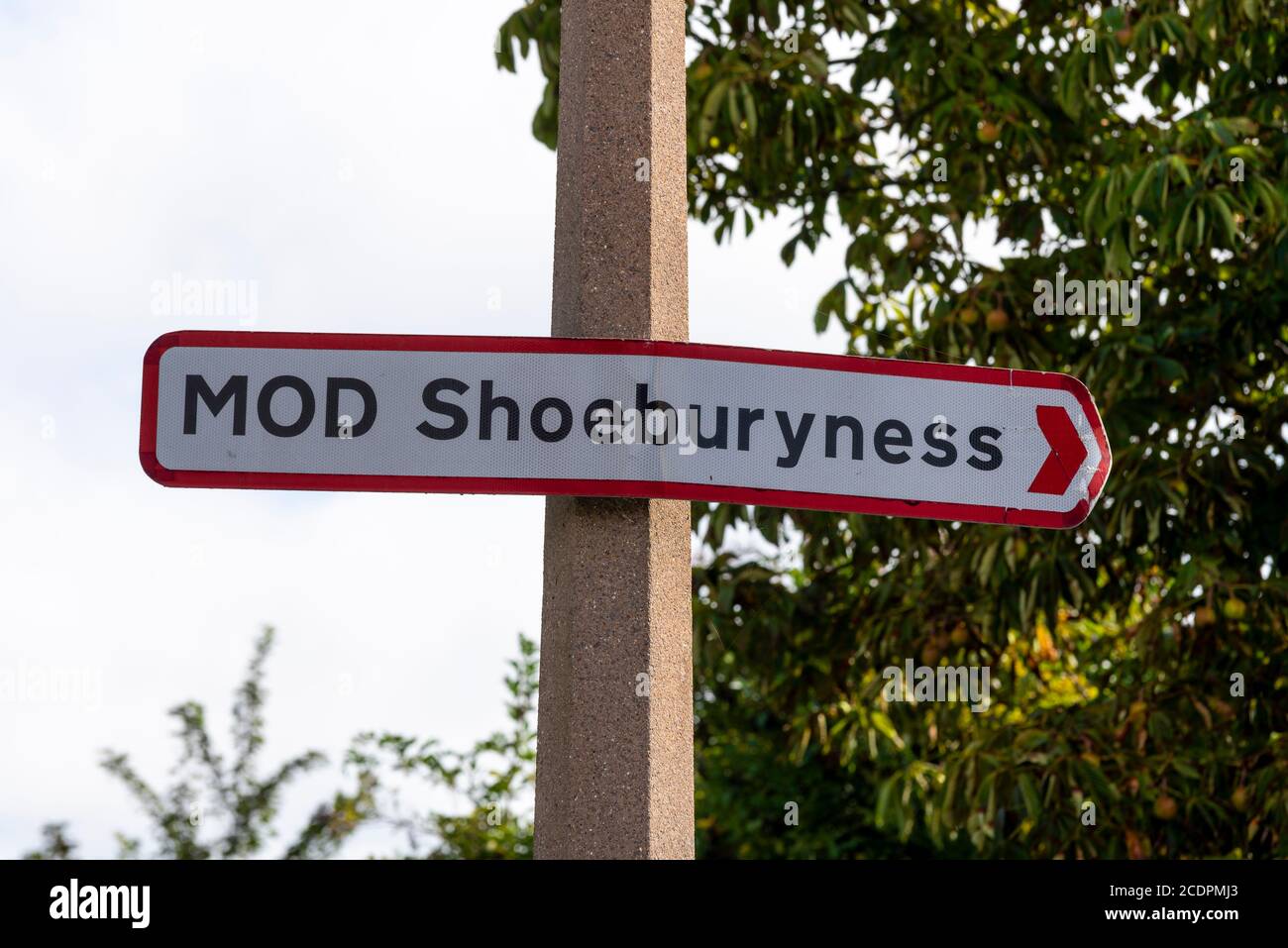 MOD Shoeburyness sign in Great Wakering, near Southend, Essex, UK. Lamp post sign post Stock Photo