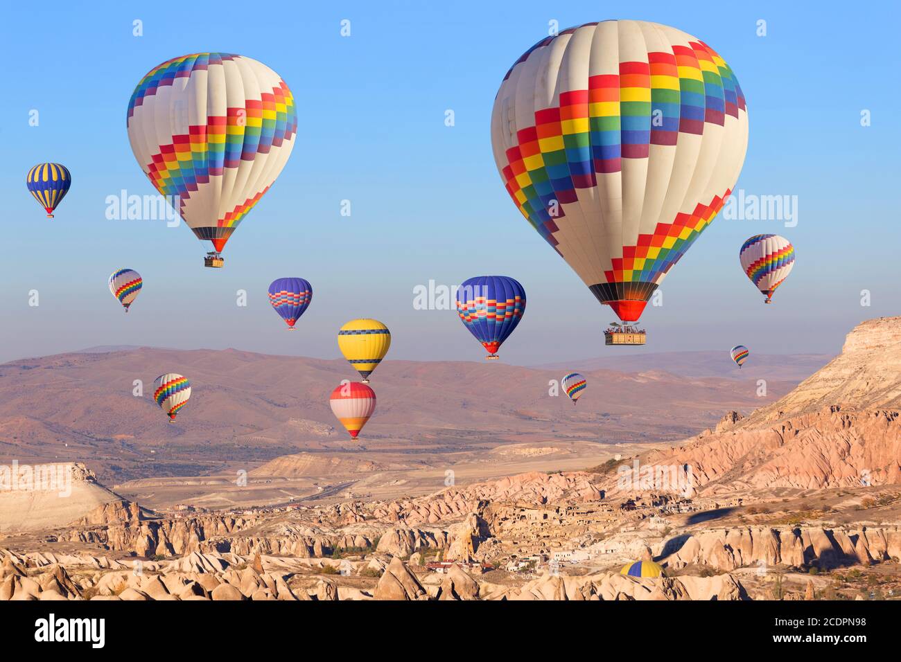Hot air balloon flying over rock landscape at Cappadocia Turkey Stock ...
