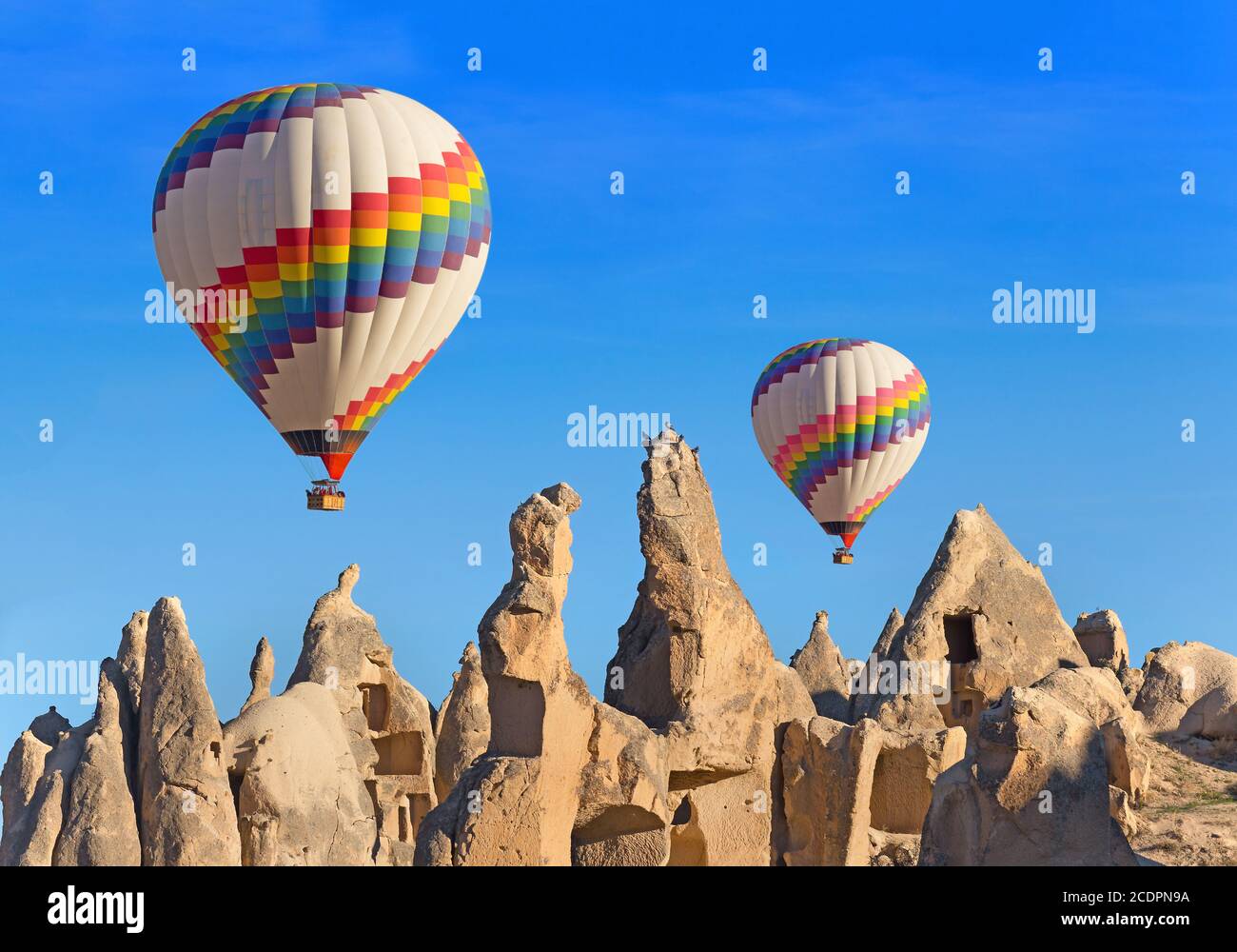 Hot air balloon flying over rock landscape at Cappadocia Turkey Stock ...