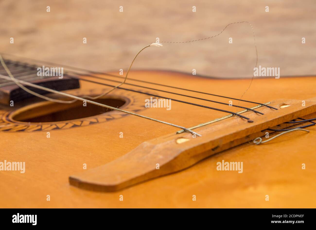 Broken guitar strings, guitar repair Stock Photo Alamy