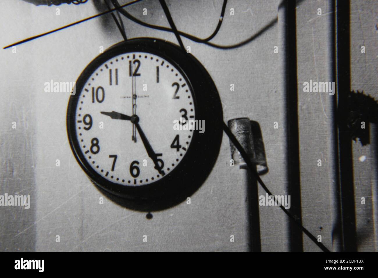 Fine 1970s vintage black and white photography of a wall clock hanging ...