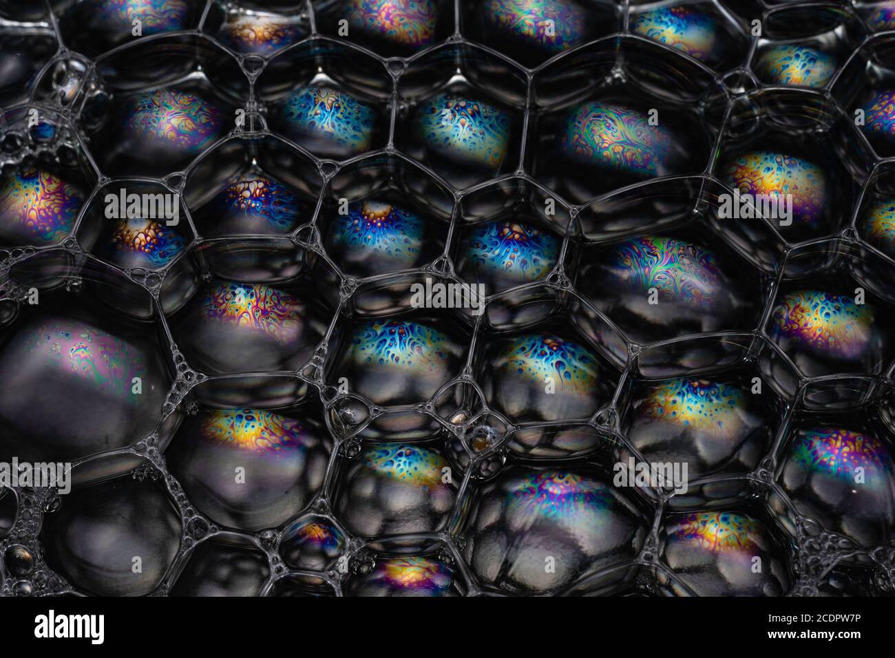 Colourful reflections and geometric patterns in this macro image Stock Photo